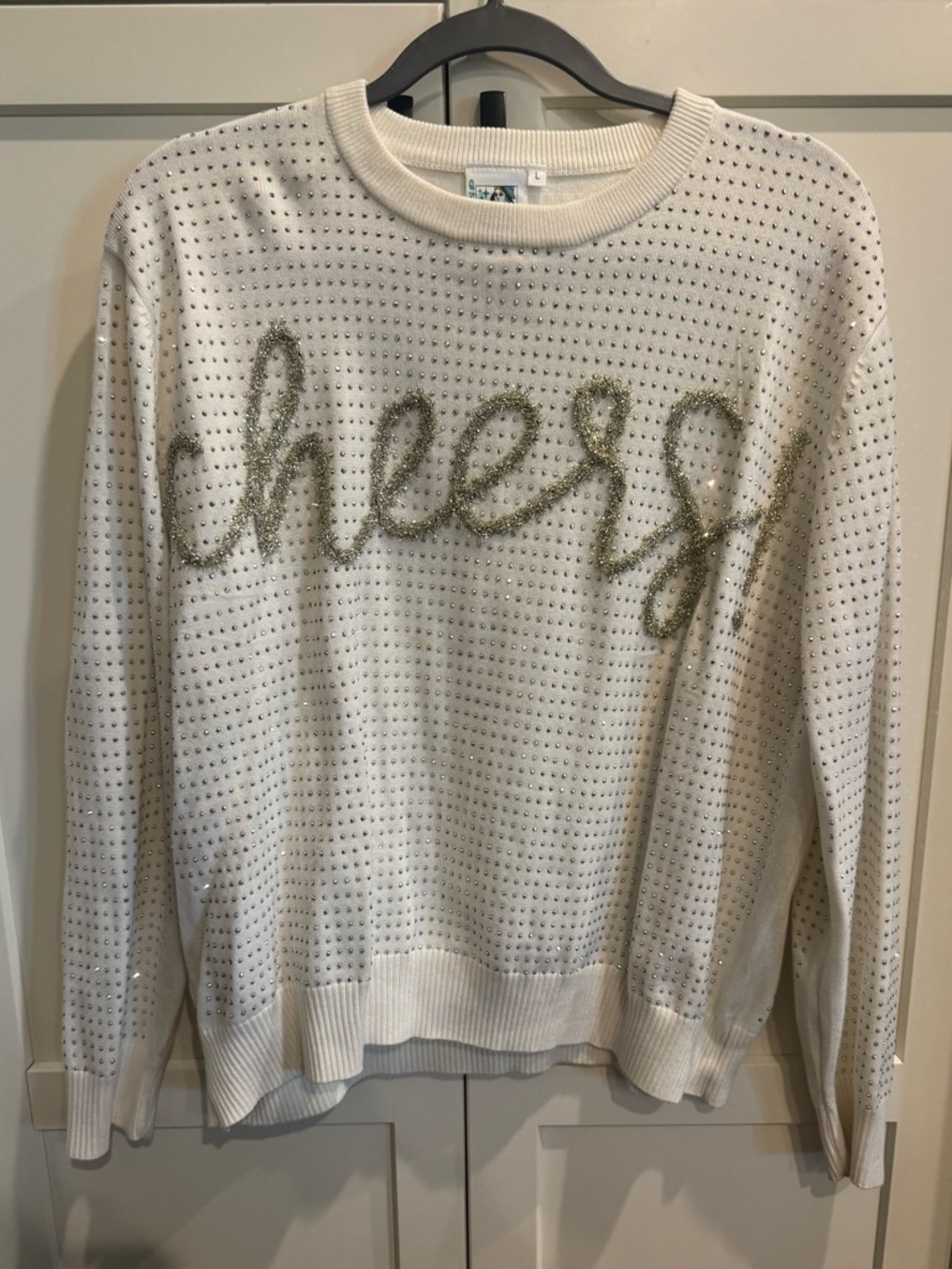 QUEEN OF SPARKLES Cream Sweater with Gold 'cheers' Script